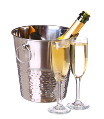 Champagne bottle in bucket with ice and glasses of champagne, is