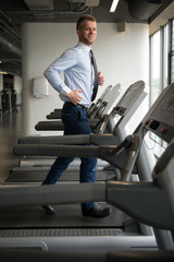 Fototapeta na wymiar Businessman Exercising In Gym