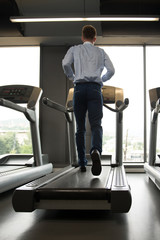 Businessman Running On Treadmill
