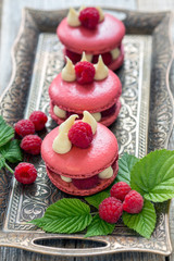Macaroons with raspberries.
