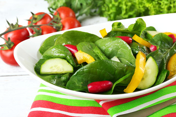 fresh vegetable salad in bowl on table close up