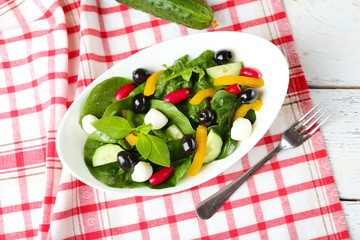 fresh vegetable salad in bowl on table close up