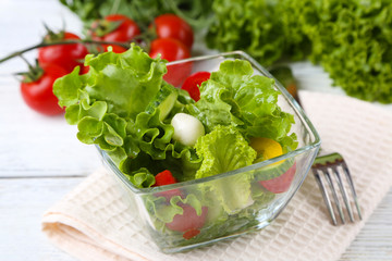 fresh vegetable salad in bowl on table close up