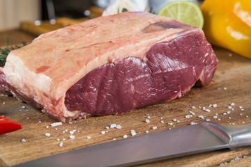 Organic Red Raw Steak Sirloin on wooden board