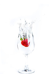 Strawberry in wine glass  on a white background