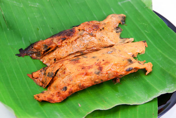 Fish curry in banana leaves
