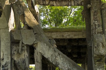 Concrete block hanging in a building destroyed by bomb
