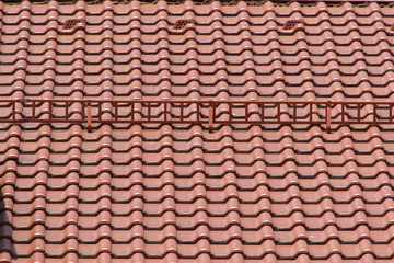 Terracotta brown metallic tiles on roof