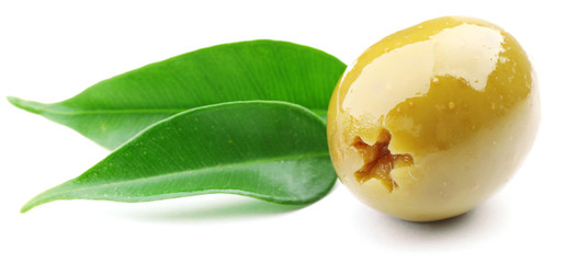 Green olive with leaves isolated on white