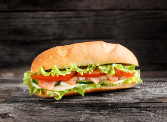 Sandwich with salmon and vegetables