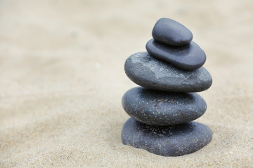 Fototapeta na wymiar Zen stones balance spa on beach