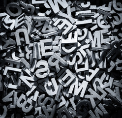 Monochrome letters in a pile