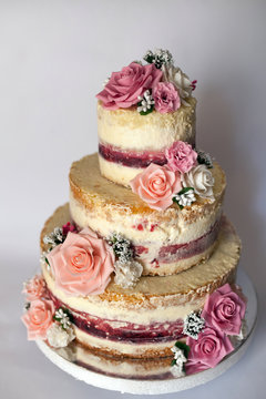 Wedding Cake. Naked Handmade Cake Rustic, Decorated With Roses.