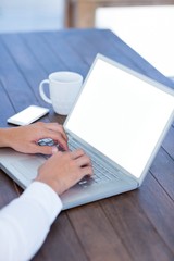 Fototapeta na wymiar Close up view of a businessman typing on laptop