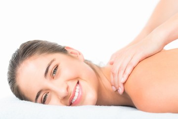 Obraz na płótnie Canvas Beautiful smiling of pretty woman on massage table 