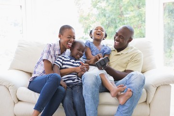 Happy smiling family on the couch 