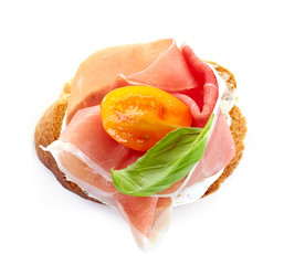 toasted bread with smoked meat and tomato