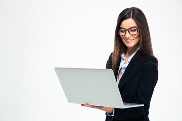 Smiling businesswoman using laptop