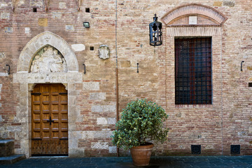 Fototapeta na wymiar antique doorway to the Tuscan house , Siena , Italy