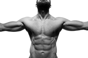 Male Muscular Torso. Close up of fit male torso and abdominal muscle with arms outstretched. Black and White studio shot isolated on white.