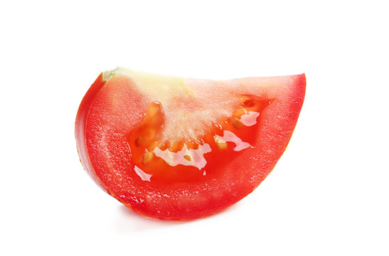 Piece of tomato isolated on white