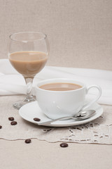 Cup Of Coffee and Irish Cream Liquor. Natural Linen Background