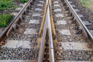 Fototapeta premium railroad tracks with railroad switch, two paths come together