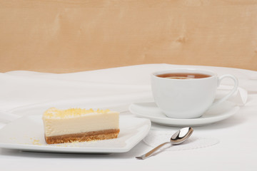 Obraz na płótnie Canvas Cheese Cake With Lemon Zest. Tea With Lemon Slice