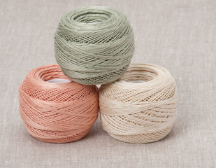 Thread Spools On Natural Linen Background