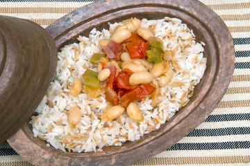 Turkish traditional meal, beans, rice, mixed pickles and tzatziki