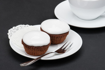 Cupcakes With Cocoa And White Cream
