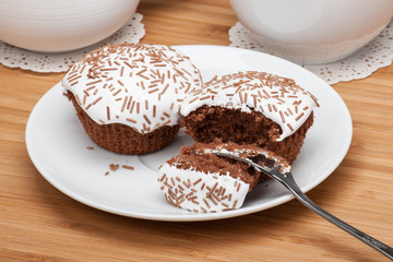 Cupcakes With Cocoa White Cream And Sprinkles