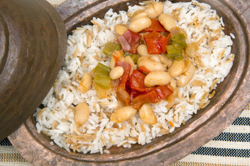Turkish traditional meal, beans, rice, mixed pickles and tzatziki