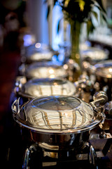 Buffet Table with Row of Food Service Steam Pans