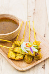 Grilled pork satay with peanut sauce.