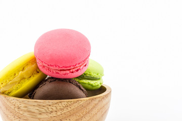 Sweet and colourful french macaron on white background.
