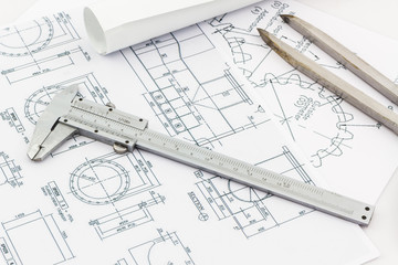 Engineering dividers Tools and Vernier scale on blueprint backgr