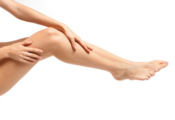 Long woman legs isolated on white. Depilation or another healths concept