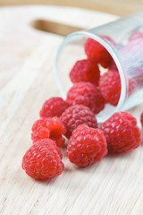 Raspberry on old vintage wooden table.