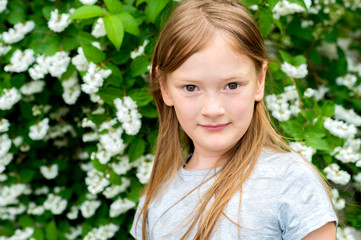 Fototapeta premium Close up portrait of a cute little girl of 7 years old