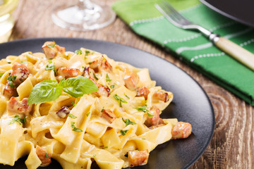 Pasta Carbonara with bacon, basil and cheese