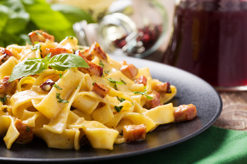 Pasta Carbonara with bacon, basil and cheese