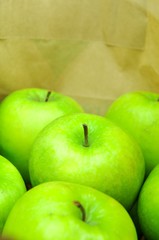 Close up of green apples in shopping bag