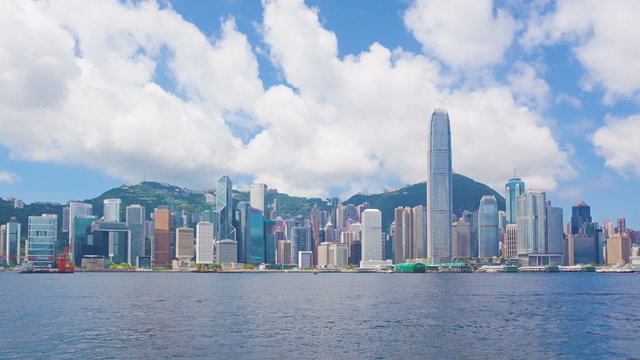 Timelapse video of Victoria Harbour in Hong Kong in daytime, zooming in