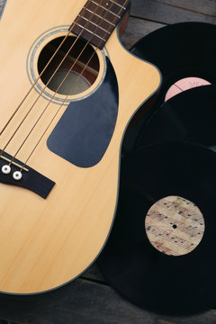 Guitar and vinyl records close up