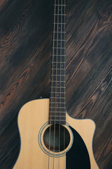 Naklejka na ściany i meble Acoustic guitar on wooden background