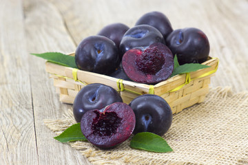 fresh plums in a basket