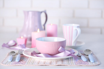 Beautiful holiday table setting in pink color