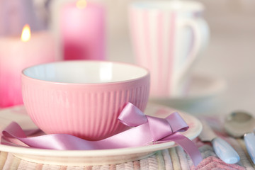 Beautiful holiday table setting in pink color