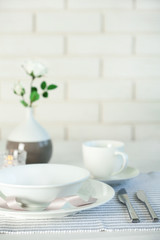 Beautiful holiday table setting in white and gray color